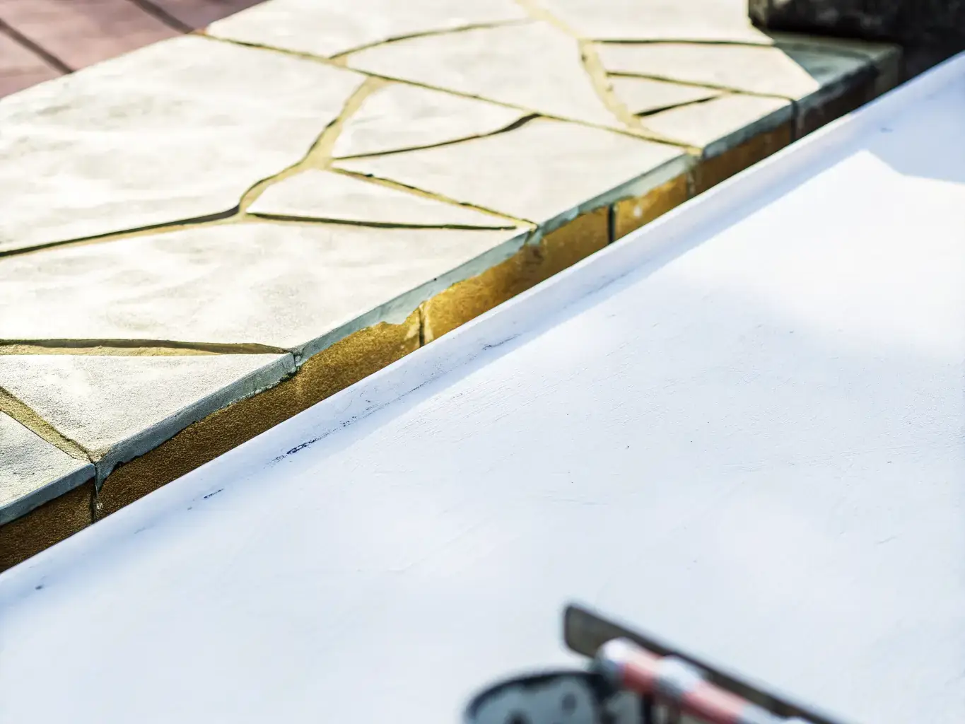 Close-up of decorative concrete resurfacing with stone pattern finish on Florida patio