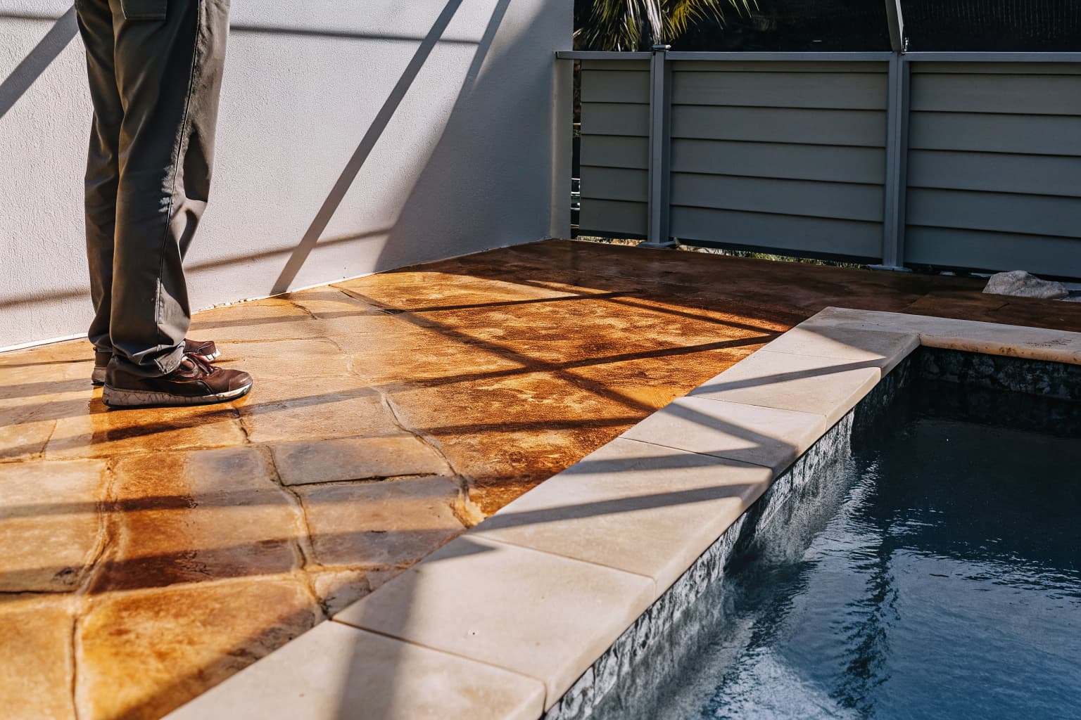 Decorative concrete pool deck in Naples FL with warm stone texture