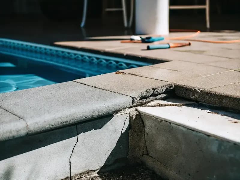 Cracked and spalling concrete repaired before resurfacing in Naples FL